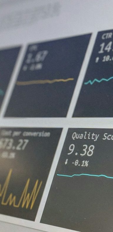 Computer Metrics Graphs and metrics are displayed on a digital dashboard showing performance data.