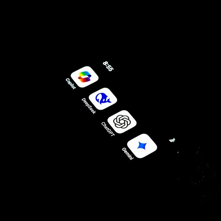 Four main Ai apps on a screen Four app icons displayed on a smartphone screen against a dark background.